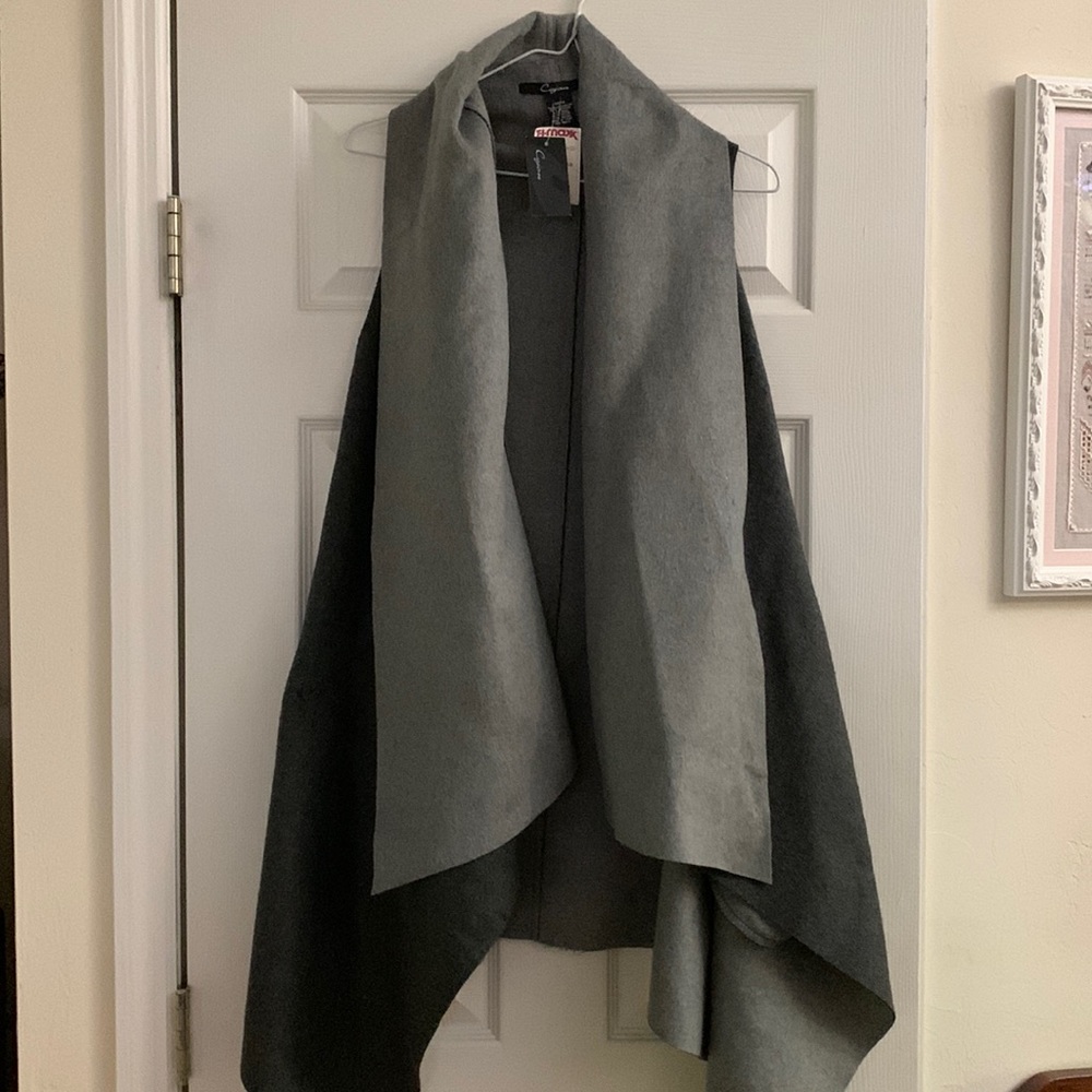 One size fits all. Brand new gray vest.
